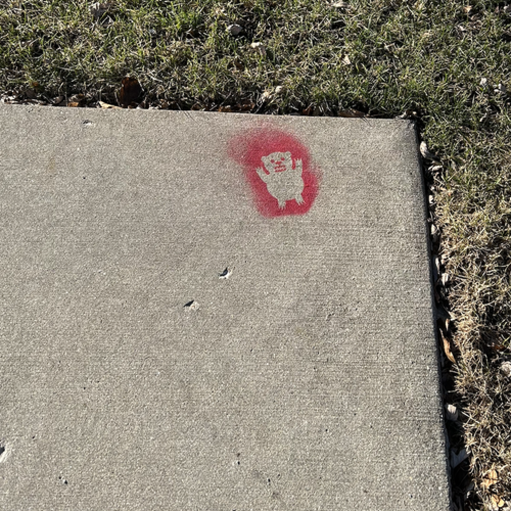 Photo of red bear stencil on corner without a ramp